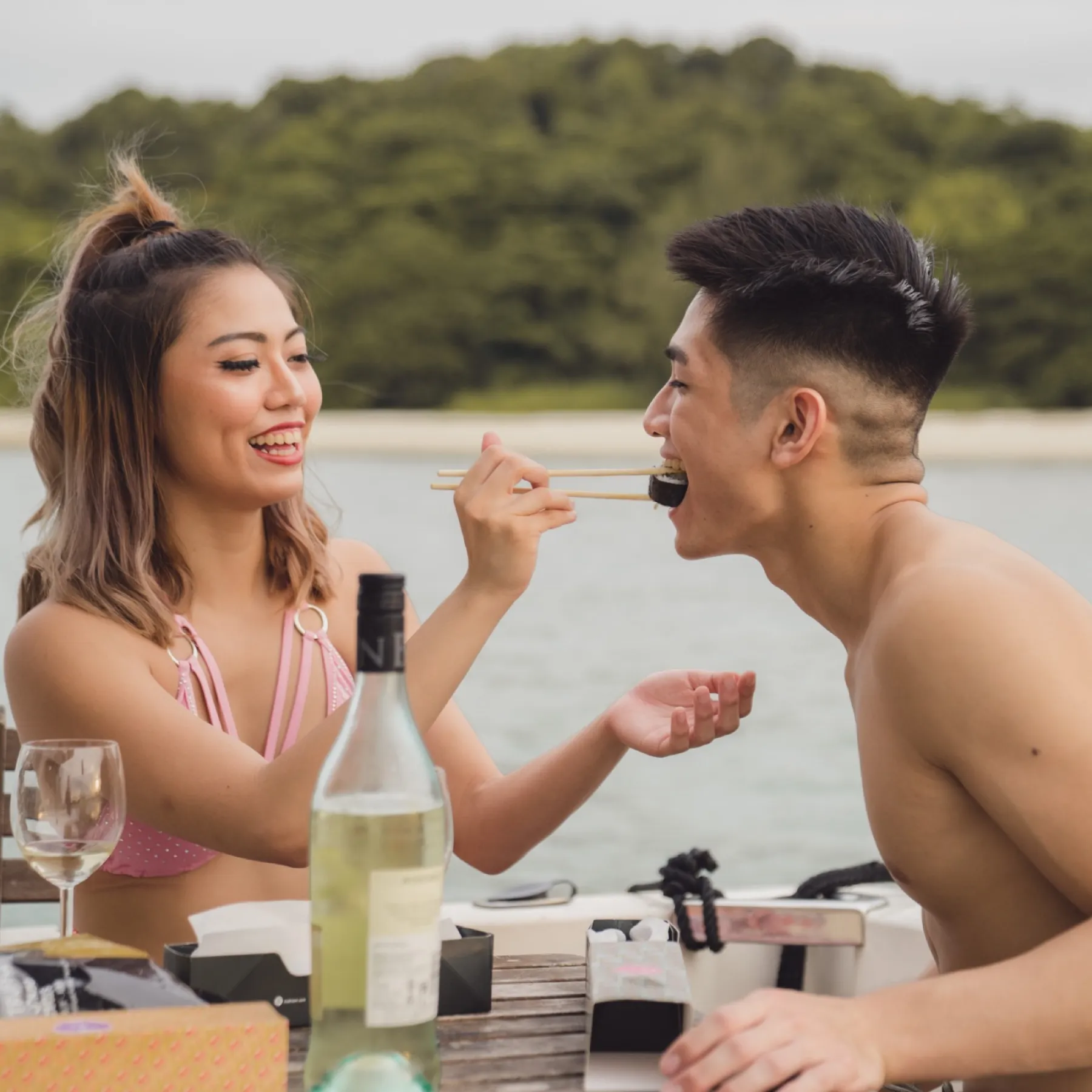 Guests sharing BBQ on board