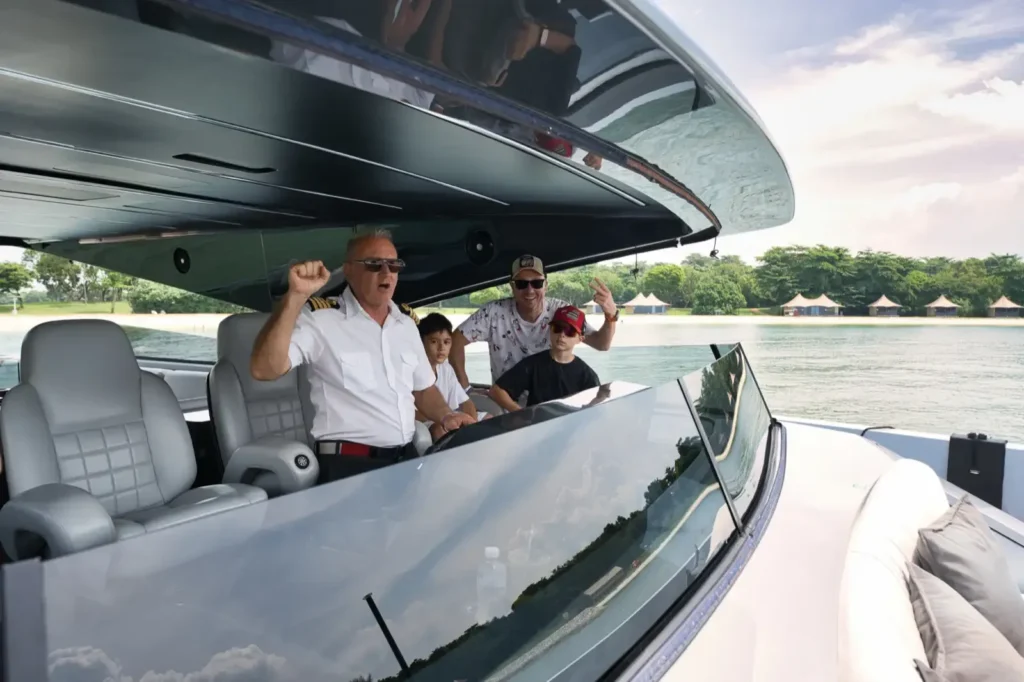 Seawind captain at the helm with guests